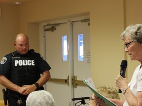 SAMANTHA REED/FOR THE INTELLIGENCER
Const. Brad Stitt of Belleville police listens to resident Margaret O’Neil during a presentation at Amica at Quinte Gardens Retirement Residence Thursday morning. The presentation made by Belleville Police outlined the various dangers and concerns officers have for putting a crosswalk on College Street West.