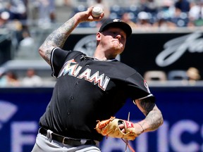 The Dodgers acquired starting pitcher Mat Latos from the Marlins in a three-team trade that also involves the Braves and 12 other players. (Don Boomer/AP)