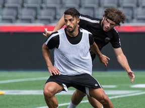 Ottawa Fury FC forwards Ugur Albayrak (L) and Tommy Heinemann battle for a ball during practice at TD Place in Ottawa on Thursday, July 30, 2015. Errol McGihon/Ottawa Sun/Postmedia Network