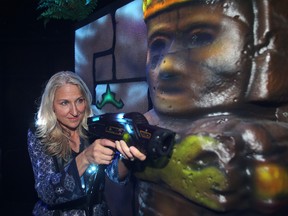 LaserTopia co-owner Elisia Ellie plays  laser tag in her business in Winnipeg, Man. Monday July 27, 2015.