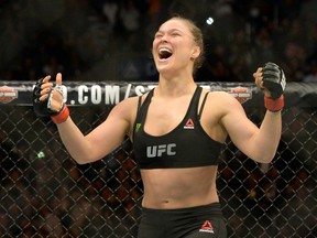 Ronda Rousey reacts after defeating Cat Zingano during their women’s bantamweight title bout at UFC 184 at Staples Center. (Jayne Kamin-Oncea/USA TODAY Sports)