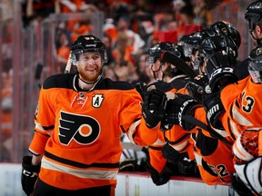 Jakub Voracek of the Philadelphia Flyers celebrates with players on the bench during NHL play against the Pittsburgh Penguins on April 5, 2015 at the Wells Fargo Center in Philadelphia. (Elsa/Getty Images/AFP)