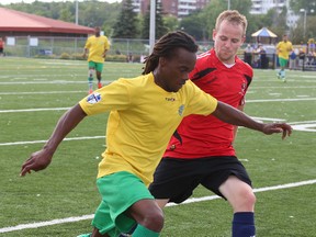 Jelomi DeJonge of Scarborough City Celtic (yellow jersey) and Jesse Stratton from Mississauga A.C. Diavoli (red) compete in the 2014 Sudbury Star Cup final. The 2015 edition of the tournament will be held at James Jerome Sports Complex this weekend. Gino Donato/The Sudbury Star/Postmedia Network