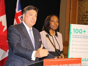 Ontario Finance Minister Charles Sousa and Associate Finance Minister Mitzie Hunter accuse the Stephen Harper government of playing politics by blocking CPP participation in the provincial pension proposal Thursday, July 30 2015. (Antonella Artuso/Toronto Sun)
