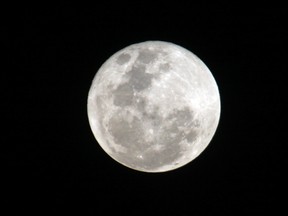 This Saturday, Jan. 30, 2010 file photo shows the full moon from Nairobi, Kenya; as the second one of the month, it is also called a "blue moon." A blue moon is expected to appear at 6:43 a.m. EDT Friday, July 31, 2015. (AP Photo/Sayyid Azim)