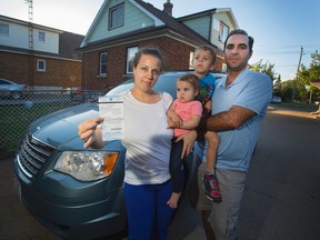 Maria Marques and husband Jeffery, with son Vincenzo, 5, and daughter Natalia, 13 months, were upset to be issued a parking ticket in London while Maria was breastfeeding in their van. A parking meter attendant would not give them a few minutes to finish feeding their daughter before they paid the meter. (Julie Jocsak, Postmedia Network)