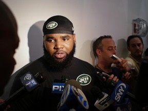 New York Jets defensive end Sheldon Richardson responds to questions during an interview after practice at training camp, Thursday, July 30, 2015, in Florham Park, N.J. (AP Photo/Frank Franklin II)