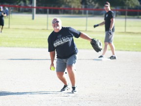 The OPP pitcher prepares to toss in the ball in the 2015 Don Johnston Memorial Slo-Pitch Tournament. (Dave Flaherty/Postmedia Network)
