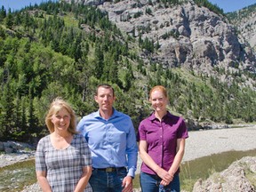 The federal government announced a $22,696 grant for the Hidden Creek Riparian Restoration Project on July 30, 2015. Oldman Watershed Council planning manager Connie Simmons (left), Macleod MP John Barlow (centre) and Trout Unlimited Canada provincial biologist Lesley Peterson (right) stand in front of The Gap where the Oldman River flows through Livingstone Range. John Stoesser photo/Pincher Creek Echo.