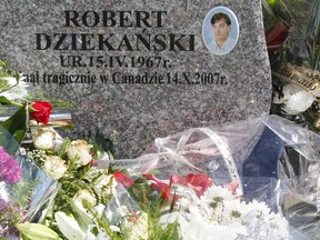 The grave of Robert Dziekanski is seen at a cemetery in Pieszyce, Southern Poland, July 19, 2008. Dziekanski died after police shot him with a Taser stun gun and restrained him at Vancouver airport. The incident was caught on video by another passenger and broadcast around the world. The tomb stone says "Died tragically in Canada on October 14, 2007".