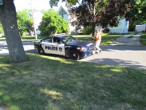 Sarnia Police investigate a sudden death Friday July 31, 2015 on Kathleen Avenue in Sarnia, Ont. A passerby noticed a man on the ground early Friday morning. Paul Morden/Sarnia Observer/Postmedia Network