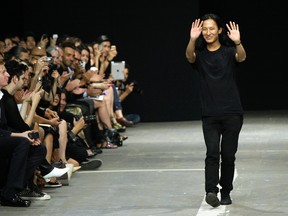 FILE - This Sept. 8, 2012 file photo shows designer Alexander Wang after his Spring 2013 collection was modeled during Fashion Week, in New York. Balenciaga says designer Alexander Wang is leaving the fashion house after three years as creative director.(AP Photo/Richard Drew, file)