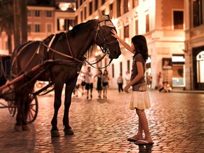 There’s magic afoot when you sightsee at night in Rome, as this young girl discovers near the Spanish Steps. DOMINIC ARIZONA BONUCCELLI PHOTO