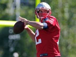 New England Patriots quarterback Tom Brady throws during an NFL football training camp in Foxborough, Mass., Friday, July 31, 2015. (AP Photo/Charles Krupa)