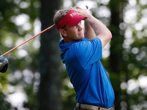 Billy Hurley III watches his drive on the 15th hole during the first round of the Quicken Loans National at the Robert Trent Jones Golf Club on July 30, 2015 in Gainesville, Virginia. (Rob Carr/Getty Images/AFP)