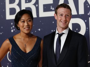 Mark Zuckerberg, right, founder and CEO of Facebook, and wife Priscilla Chan arrive on the red carpet during the 2nd annual Breakthrough Prize Award in Mountain View, California in this November 9, 2014 file photo. Facebook Inc Chief Executive Mark Zuckerberg and his wife, Priscilla Chan, are expecting a baby girl, he said on his Facebook page on July 31, 2015. (REUTERS/Stephen Lam/Files)