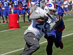 Buffalo Bills running back  LeSean McCoy carries the ball during Friday's training-camp workout at St. John Fisher College in Pittsford, N.Y. (JOHN KRYK/Toronto Sun)
