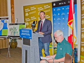 MP of the Macleod riding, John Barlow, announces $107 million grant for upgrades in Waterton Lakes National Park last summer. Ifan Thomas, superintendent of the park opened the press conference and introduced Barlow. Now, the ball is rolling on the new Waterton Visitor Centre as the contract has been awarded to FWBA Architects.