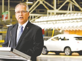 Gary Goodyear, minister of state responsible for the Federal Economic Development Agency for Southern Ontario, announces a $100-million aid package for Toyota in Cambridge Friday. (Aaron Lynett, The Canadian Press)