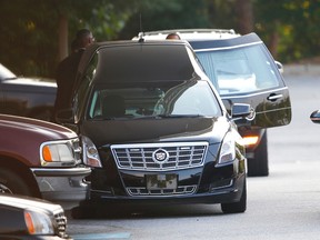 A hearse is unloaded before a funeral service for Bobbi Kristina Brown in Alpharetta, Ga., on Aug. 1, 2015. (AP Photo/John Bazemore)