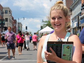 Erin York, projects manager and marketing for Downtown Kingston, organized the Princess Street Promenade in Kingston, Ont. on Saturday August 1, 2015. Steph Crosier/Kingston Whig-Standard/Postmedia Network