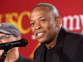 This May 15, 2013 file photo shows hip-hop mogul Dr. Dre as he announces a $70 million dollar donation to create the new "Jimmy Iovine and Andre Young Academy for Arts and Technology and Business Innovation," at the University of Southern California, in Santa Monica, Calif.  (AP Photo/Damian Dovarganes, File)