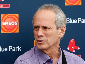 This Feb. 25, 2015, file photo shows Boston Red Sox President and Chief Executive Officer Larry Lucchino, responding to questions during a news conference in Fort Myers Fla. Lucchino is stepping down this year. Team spokesman Kevin Gregg says in an email that Lucchino hopes to remain with the club in some capacity. (AP Photo/Tony Gutierrez, File)
