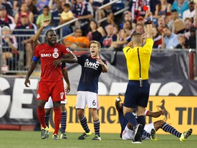 TFC’s Jozy Altidore is issued a red card and ejected after kicking out at Revolution centre back Jose Goncalves. (USA TODAY)