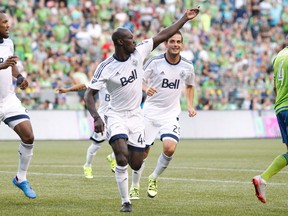 Vancouver Whitecaps defender Pa-Modou Kah, centre, celebrates after scoring a goal against the Seattle Sounders FC during the second half at CenturyLink Field. (Jennifer Buchanan-USA TODAY Sports)