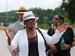 Leolah Brown talks with media members outside the church hosting a funeral service for her brother Bobby Brown's daughter, Bobbi Kristina Brown, in Alpharetta, Ga., on Aug. 1, 2015. (AP Photo/John Bazemore)