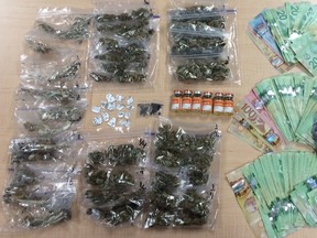 RCMP seized a large amount of drugs and cash from a vehicle, including Marijuana, Psilocybin (magic mushrooms), Ketamine, Cocaine, LSD, MDMA at a traffic stop near the Grimshaw Rodeo this weekend. PHOTO SUPPLIED