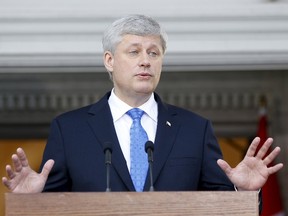 Prime Minister Stephen Harper takes part in a news conference at Rideau Hall after asking Governor General David Johnston to dissolve Parliament, beginning the longest federal election campaign in recent history on Sunday. (Blair Gable/REUTERS)