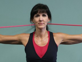 Co-owner Sandi Knox exercises at Body Balance Fitness on Henderson Highway. Knox has been named a top three finalist for Canadian Fitness Professional of the Year. (Kevin King/Winnipeg Sun/Postmedia Network)