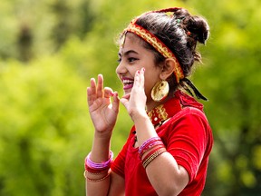 Bishala Acharya, 10, performs at the Nepal pavilion during the 40th Servus Heritage Festival in Hawrelak Park, in Edmonton Alta. on Saturday Aug. 1, 2015. David Bloom/Edmonton Sun/Postmedia Network