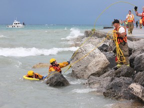 A person drowned in the waves off Kincardine’s pier shortly before 3 p.m. on Aug. 2, 2015, but little more information was available before long weekend press time. Municipality of Kincardine Fire Department search and rescue workers had to retreat from the water at about 3:30 p.m. to wait out the massive electrical and wind storm that came in off Lake Huron, while South Bruce OPP marine unit could be seen out in Lake Huron amongst the swells. (TROY PATTERSON/KINCARDINE NEWS)