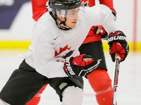 Brayden Point skates in front of Jake Virtanen on Sunday in Calgary. Point is one of five returning players hoping to keep his spot with Canada’s world junior team. (LYLE ASPINALL/POSTMEDIA NETWORK)