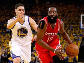 James Harden #13 of the Houston Rockets drives on Klay Thompson #11 of the Golden State Warriors in the first half during game five of the Western Conference Finals of the 2015 NBA Playoffs at ORACLE Arena on May 27, 2015 in Oakland, California.  Ezra Shaw/Getty Images/AFP