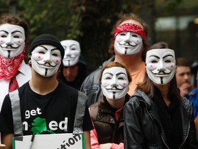 Members and supporters of the Anonymous movement wear Guy Fawkes masks as they demonstrate as part of the "Million Mask March" in Portland, Ore., in this Nov. 5, 2014. (REUTERS/Steve Dipaola)