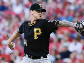 Pittsburgh Pirates starting pitcher A.J. Burnett throws in the second inning of a baseball game against the Cincinnati Reds, Thursday, July 30, 2015, in Cincinnati. (AP Photo/John Minchillo)