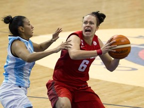 Shona Thorburn is challenged by Argentina's Debvorah Gonzalez during the preliminary round of the Pan Am Games basketball tournament. (Canadian Press)