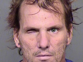 This booking photo provided by the Maricopa County Sheriff's Office shows 43-year-old Kenneth Dale Wakefield. Investigators say Wakefield killed and decapitated his 49-year-old wife, Trina Heisch, and their two dogs and then inflicted injuries on himself, including a severed left forearm and a missing eye. He was booked into Maricopa County jail Saturday afternoon, Aug. 1, 2015, on one count of first-degree murder and two counts of animal cruelty. (Maricopa County Sheriff's Office via AP)