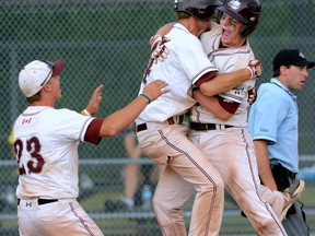 London Badger Troy Lofgren jumps into the arms of Michael Mommersteeg with Hayden Regnier after scoring the winning run in the Ontario eliminations tournament Sunday in Burlington. London defeated West Toronto 11-1 to advance to the Midget Nationals next week in Quebec. (MORRIS LAMONT, The London Free Press)