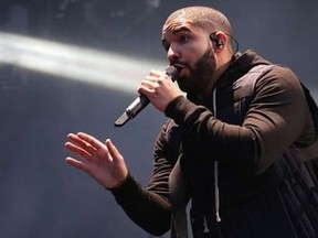Canadian singer Drake performs on the main stage at Wireless festival in Finsbury Park, London, Friday, July 3, 2015. Touch 'em all, Drake.The Toronto rapper invoked beloved ex-Blue Jays slugger Joe Carter with his latest shot in his ongoing feud with rapper Meek Mill. THE CANADIAN PRESS/AP/Photo by Joel Ryan/Invision/AP