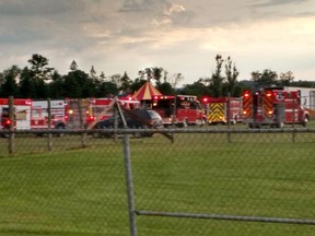 Officers surround the scene of a tent collapse in Lancaster, N.H., Monday, Aug. 3, 2015. Authorities say the circus tent collapsed when a severe storm raked the New Hampshire fairground. (Sebastian Fuentes via AP)