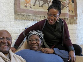 This Tuesday, July 21, 2015 photo provided by Oryx Media shows retired Anglican Archbishop Desmond Tutu, left, with his wife, Leah, center, and daughter, Mpho, at their home in Cape Town, South Africa. On Tuesday, July 28, 2015 his foundation said he returned for hospital treatment, a week after he left a hospital following an intensive antibiotics course for an infection. (Benny Gool/Oryx Media via AP)