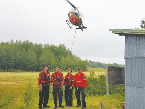 Local fire crew (left to right) Adriel Manitowabi, Tristan Dunnett, Alexane Papineau and Richard Solomon prepared to battle fires that were raging in the western provinces.