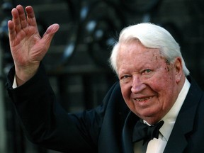 Former British Prime Minister Edward Heath waves as he arrives at number 10 Downing Street in London in this file photo dated April 29, 2002. REUTERS/STR