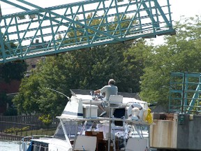 File picture: The Wallaceburg downtown walking bridge raises to allow a boat to go by in August of 2014.