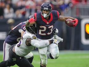 Houston Texans running back Arian Foster (23) is tackled by Baltimore Ravens linebacker Terrell Suggs during NFL play at NRG Stadium. (Troy Taormina/USA TODAY Sports)