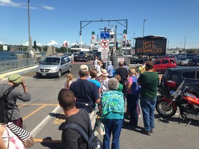 Passengers wait to board the Frontenac II in Kingston for the trip to Wolfe Island. A music festival on the island this coming weekend is expected to increase demand on the ferry. (Elliot Ferguson/The Whig-Standard)